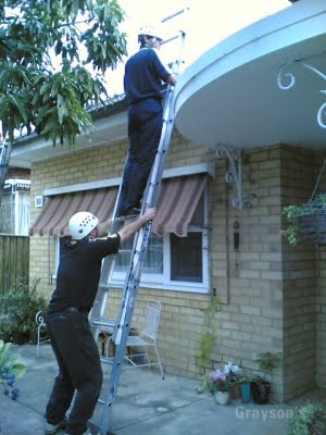two men doing gutter cleaning