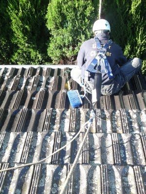 Gutter Cleaning on a terracotta tiled roof