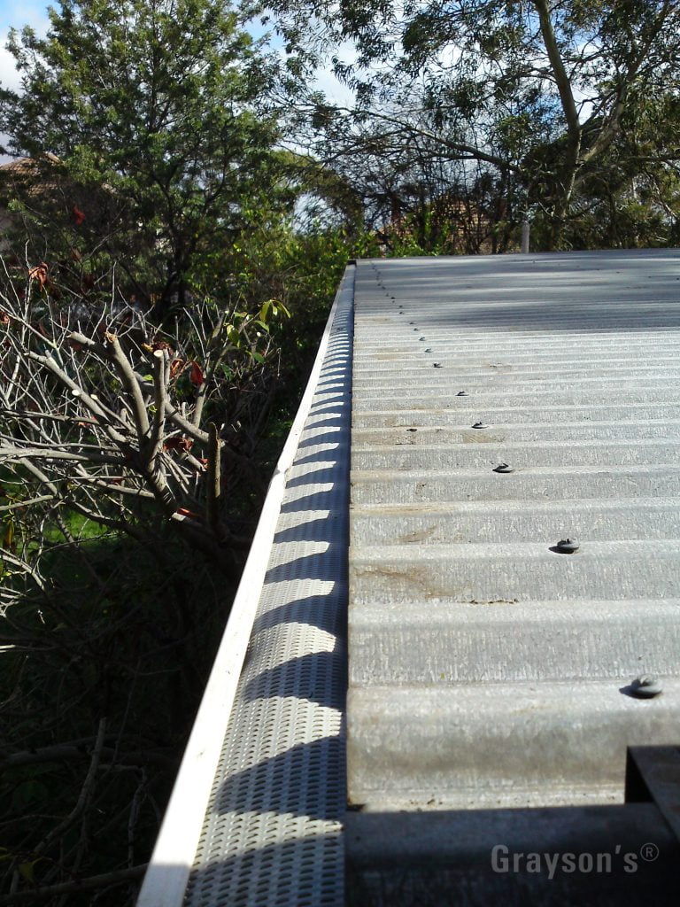 Our gutter guard on a flat metal roof