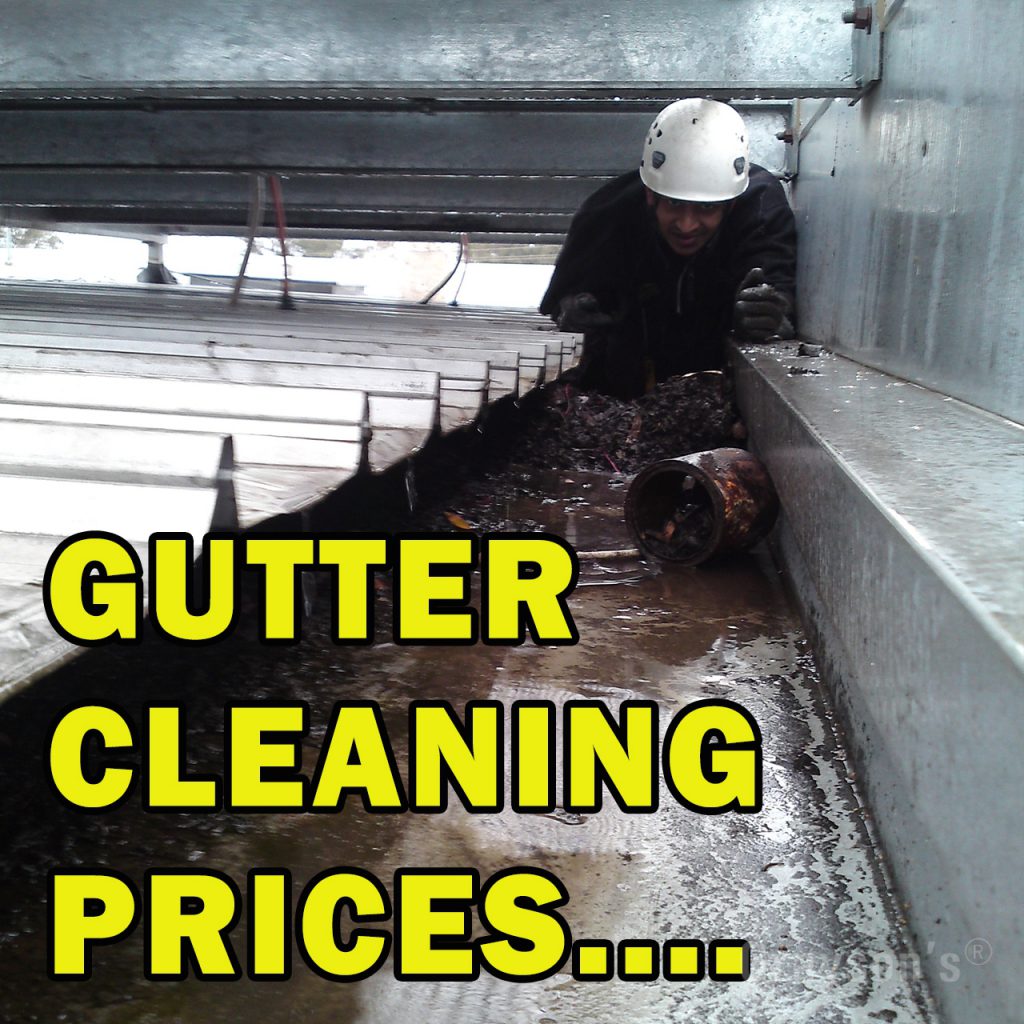One of our staff cleaning gutters in a very awkward factory gutter