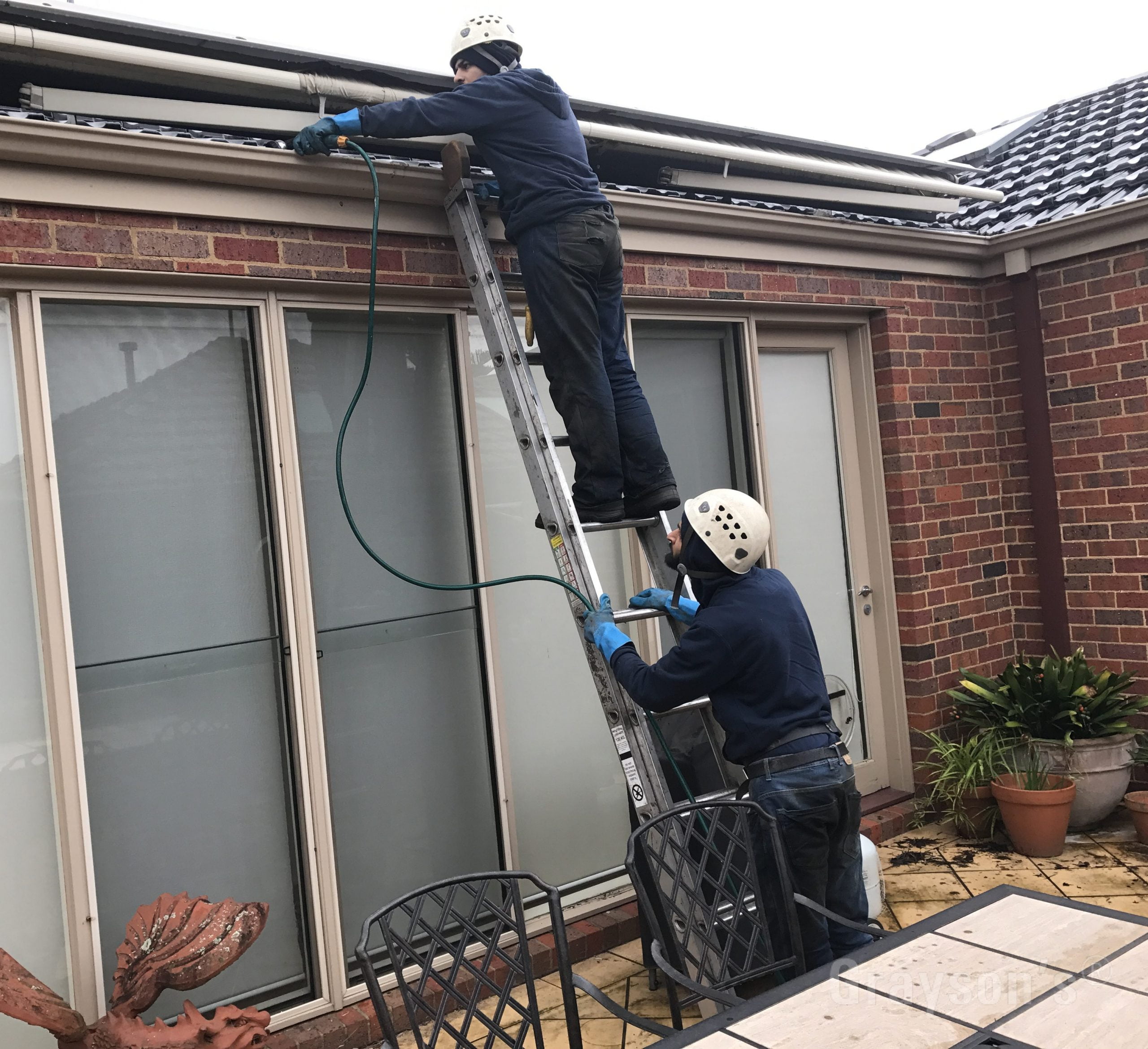 Our staff Water flushing of Gutters and Downpipes