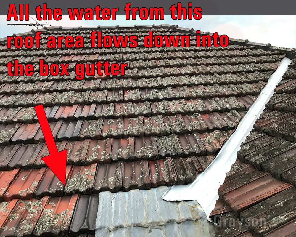 The trough below this tiled roof area must catch a tremendous amount of water in a big storm.