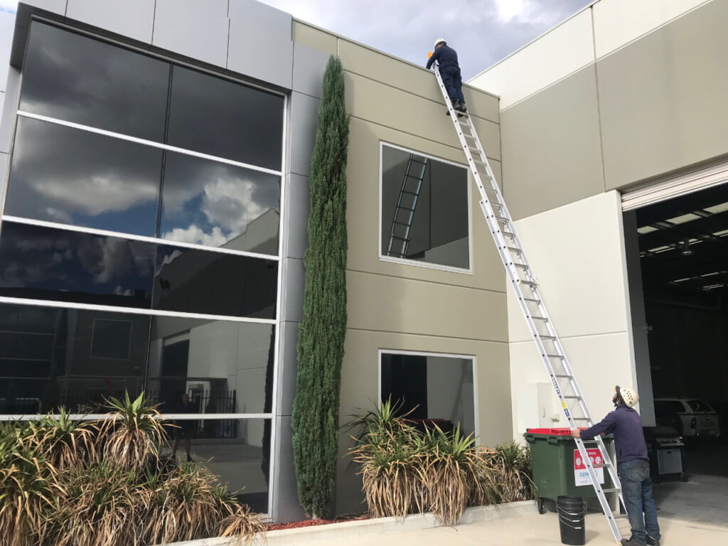 Commercial gutter cleaning of a warehouse building