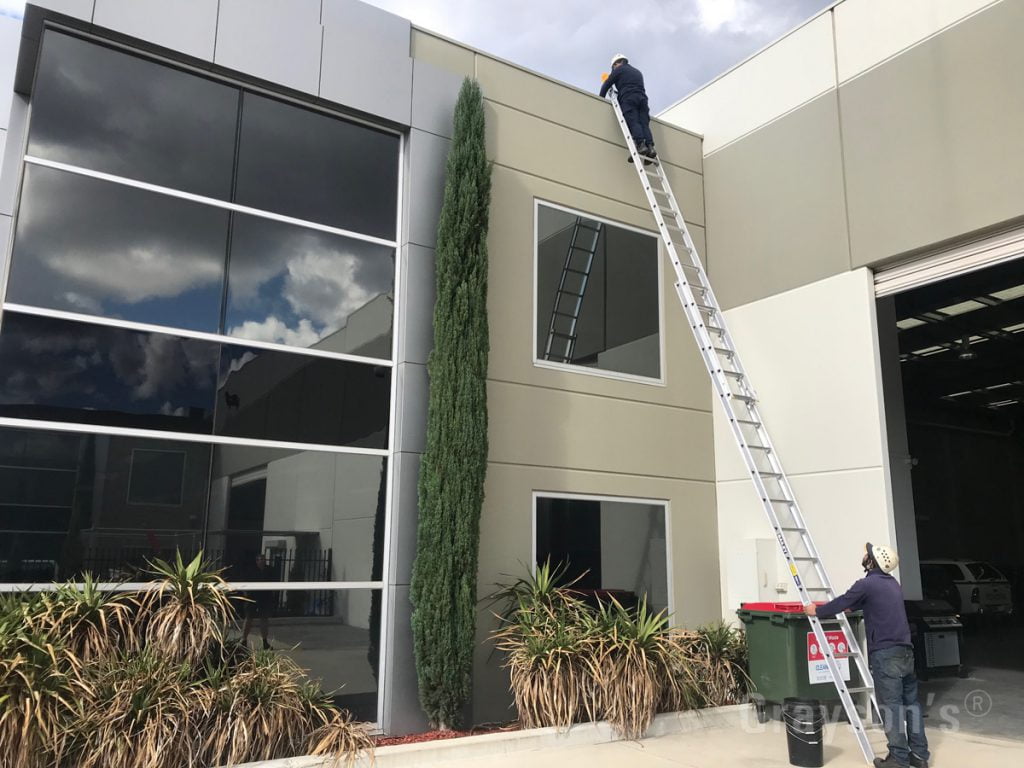 Cleaning box gutters on a commercial building