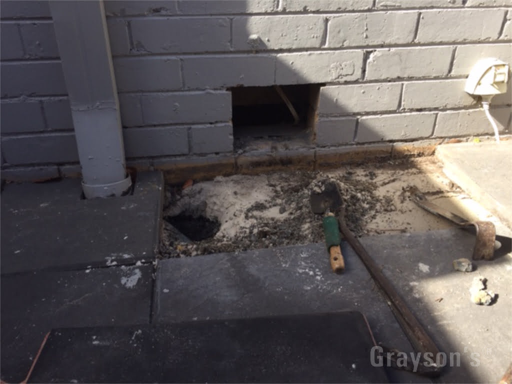 A blocked underground drain that caused internal damage